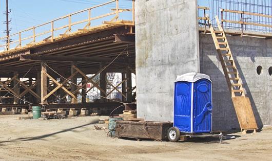 multiple porta potties ready to serve workers on a construction job